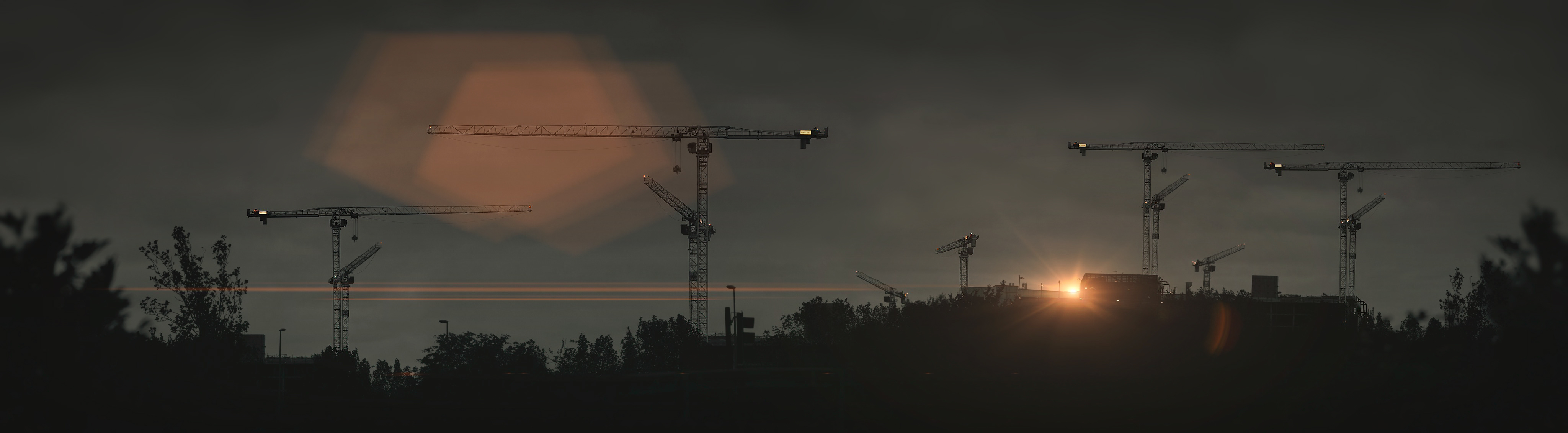 Sunset photography of cranes skyline in Milton Keynes for Santander