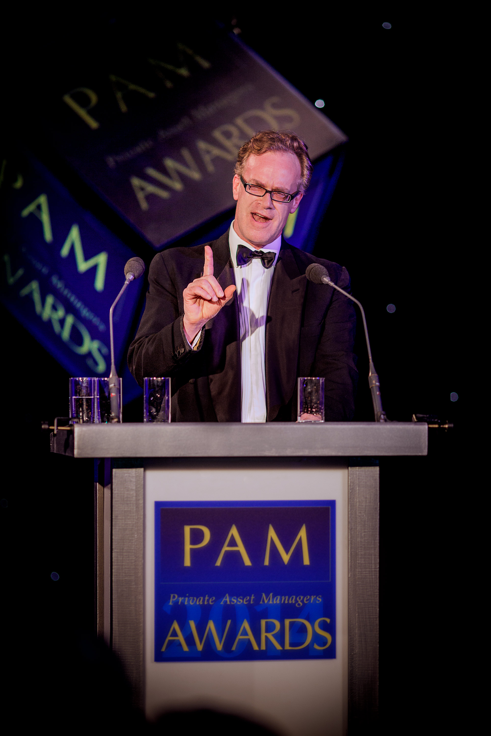 PAM Awards podium speaker wearing black tie