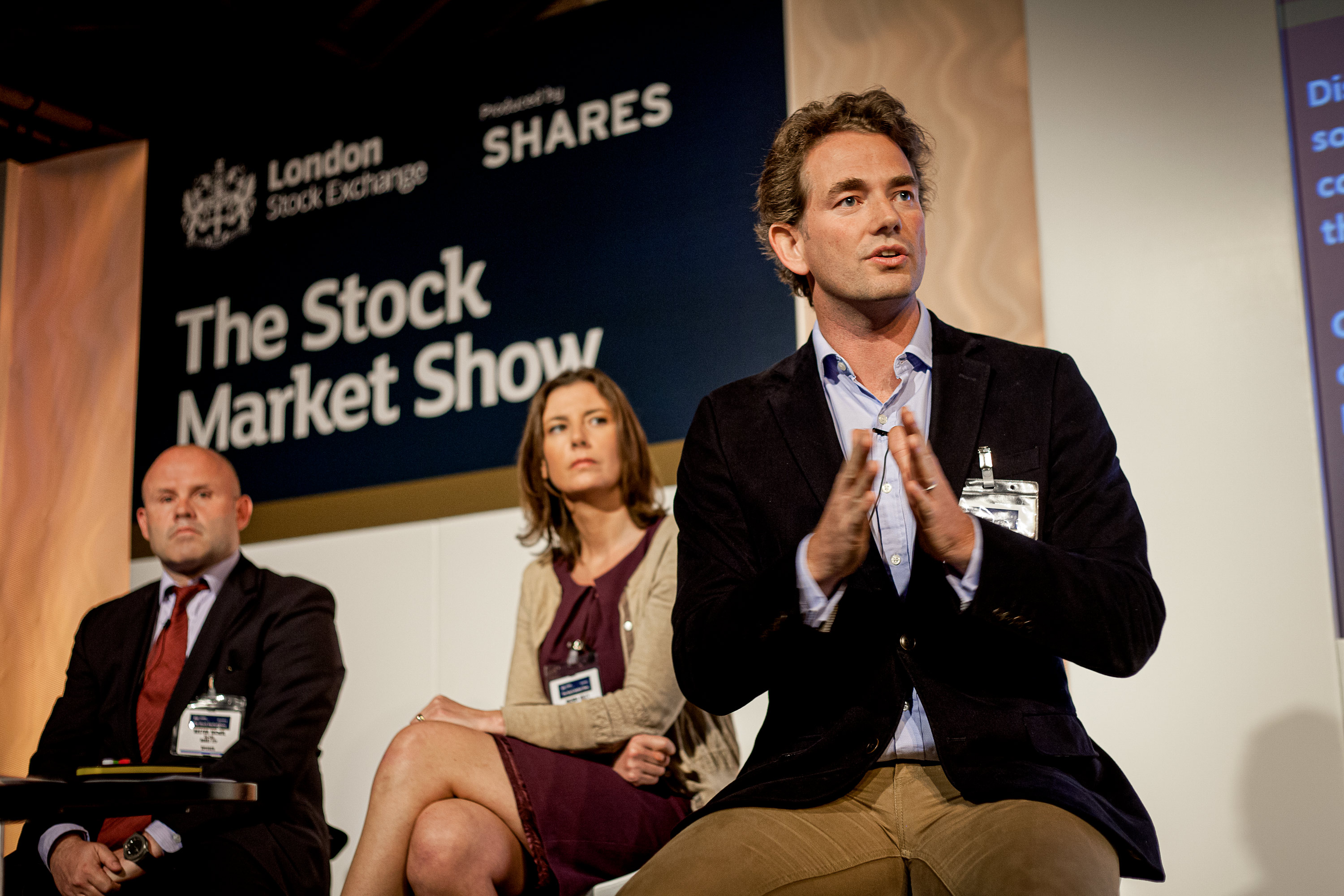 Stock Market Show conference event photograph of panel on stage