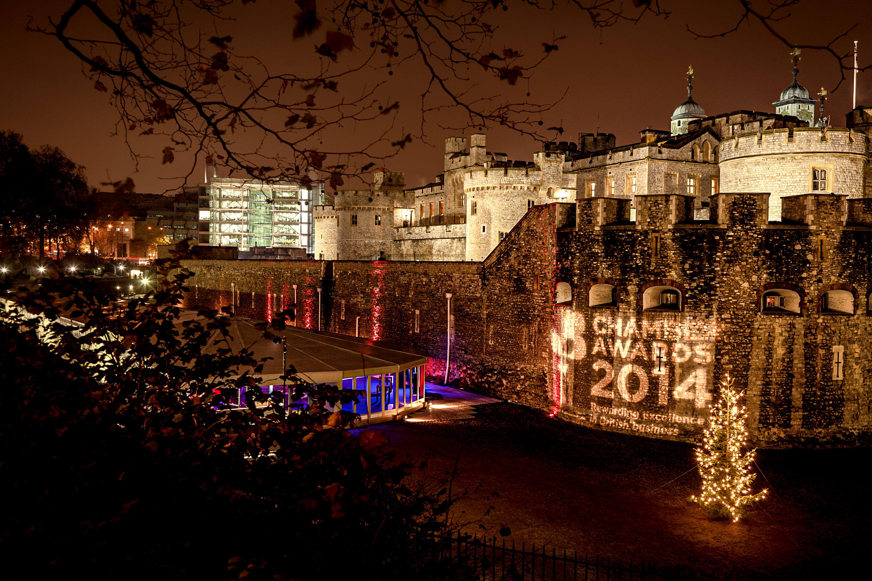 External photography of an awards event held at the Tower of London, with the brickwork illuminated