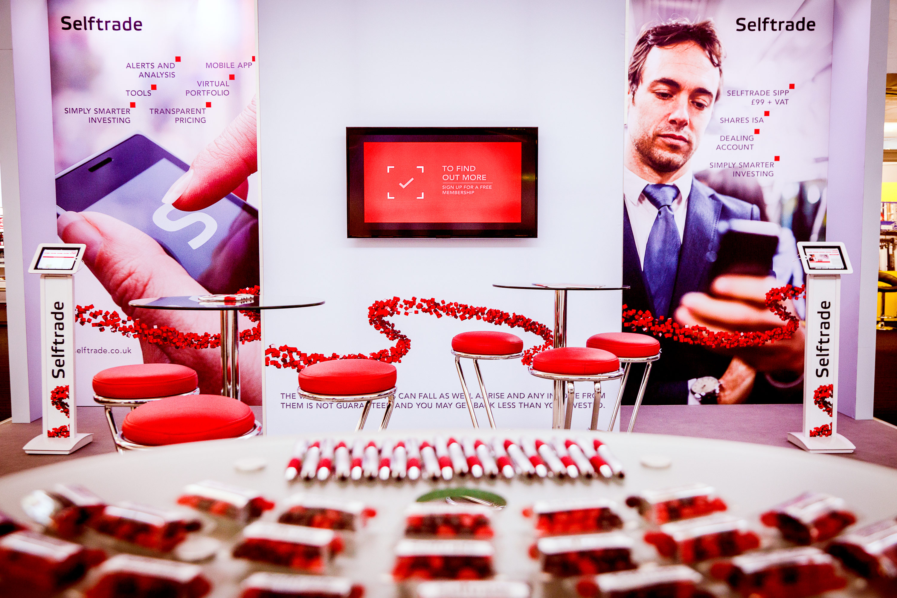 Conference trade fair stand with seating and merchandise