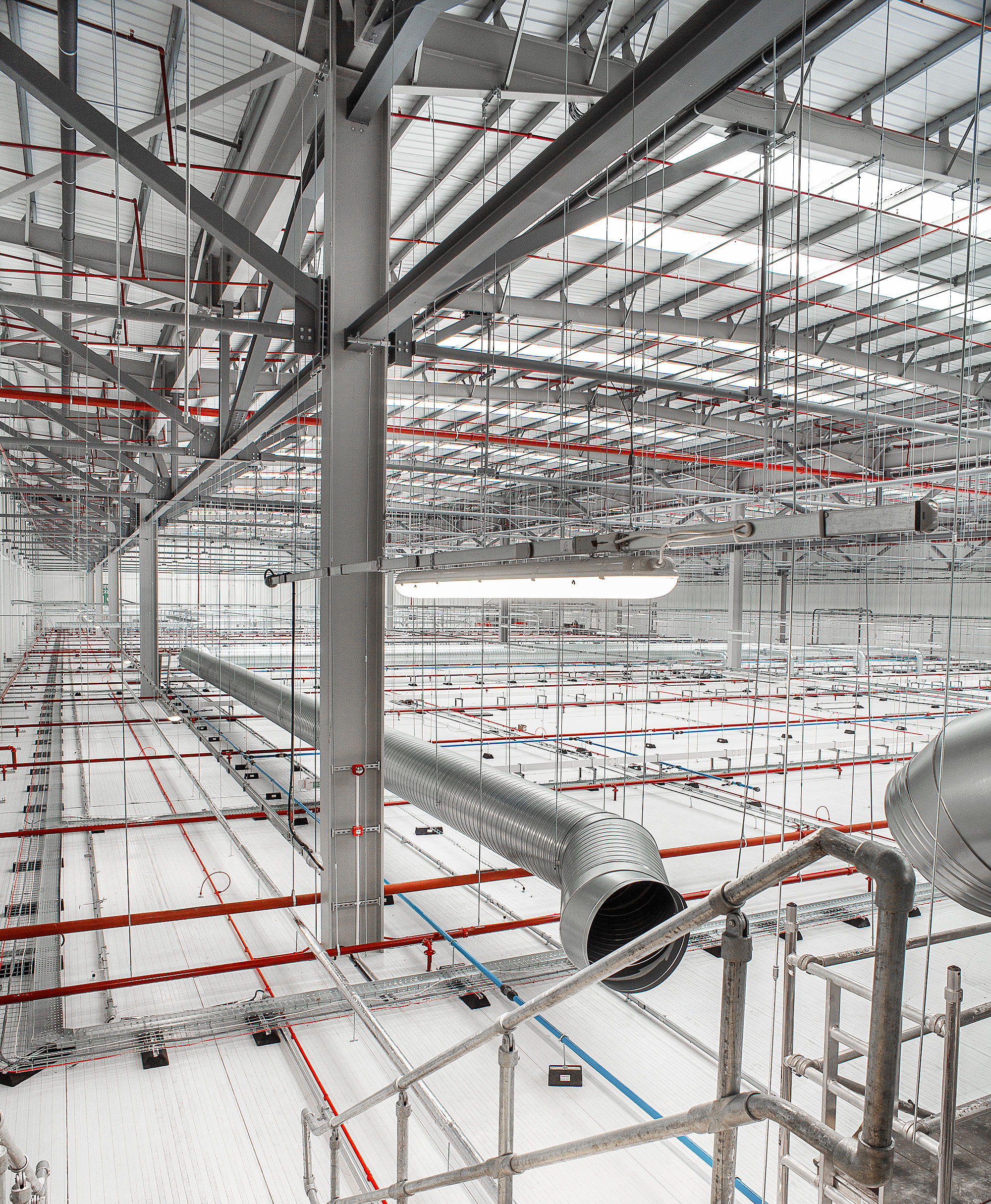 Bright commercial photography of internal industrial unit showcasing steels and pipes