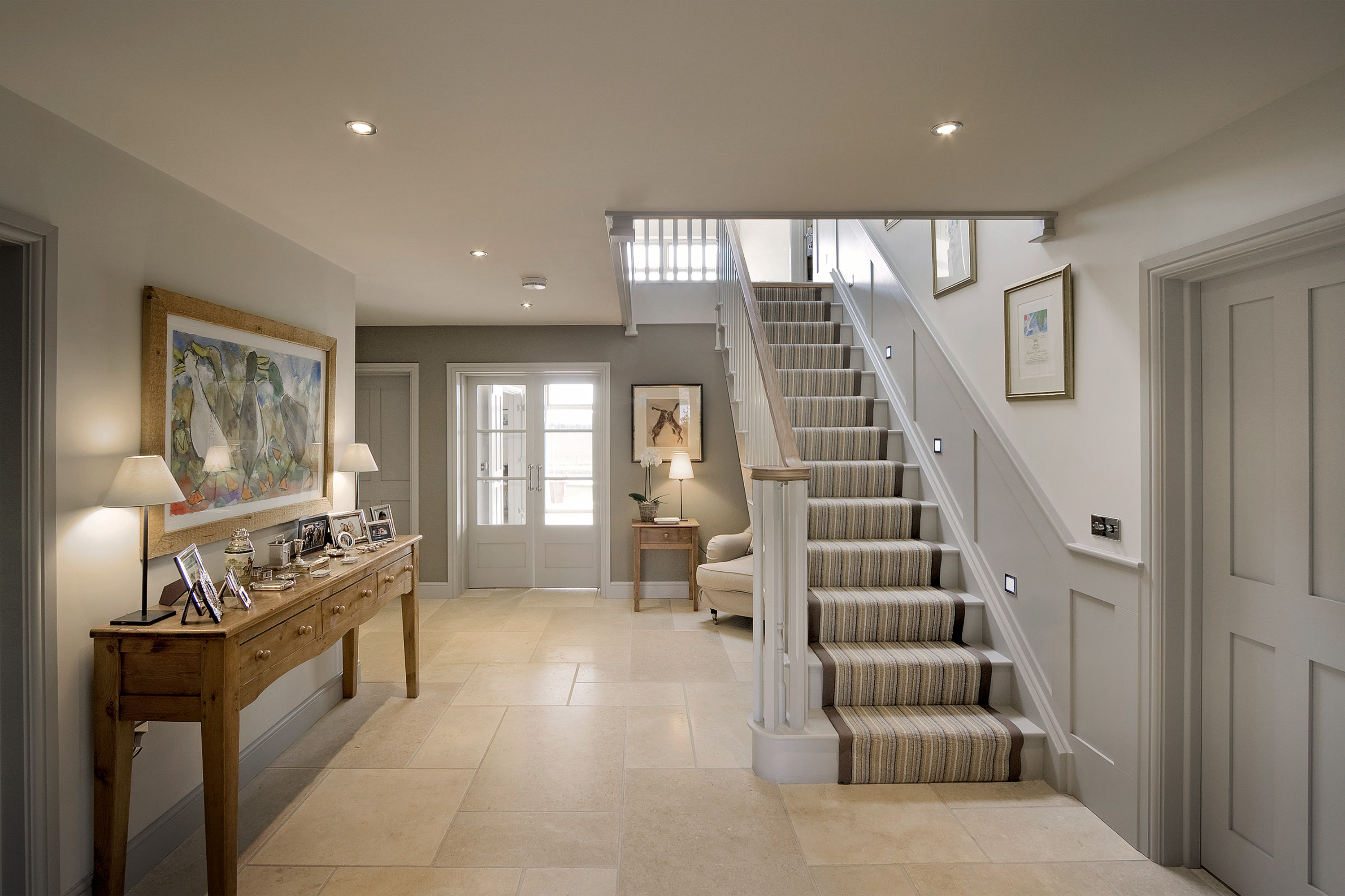 House interior advertising photo of hallway and staircase for carpet company