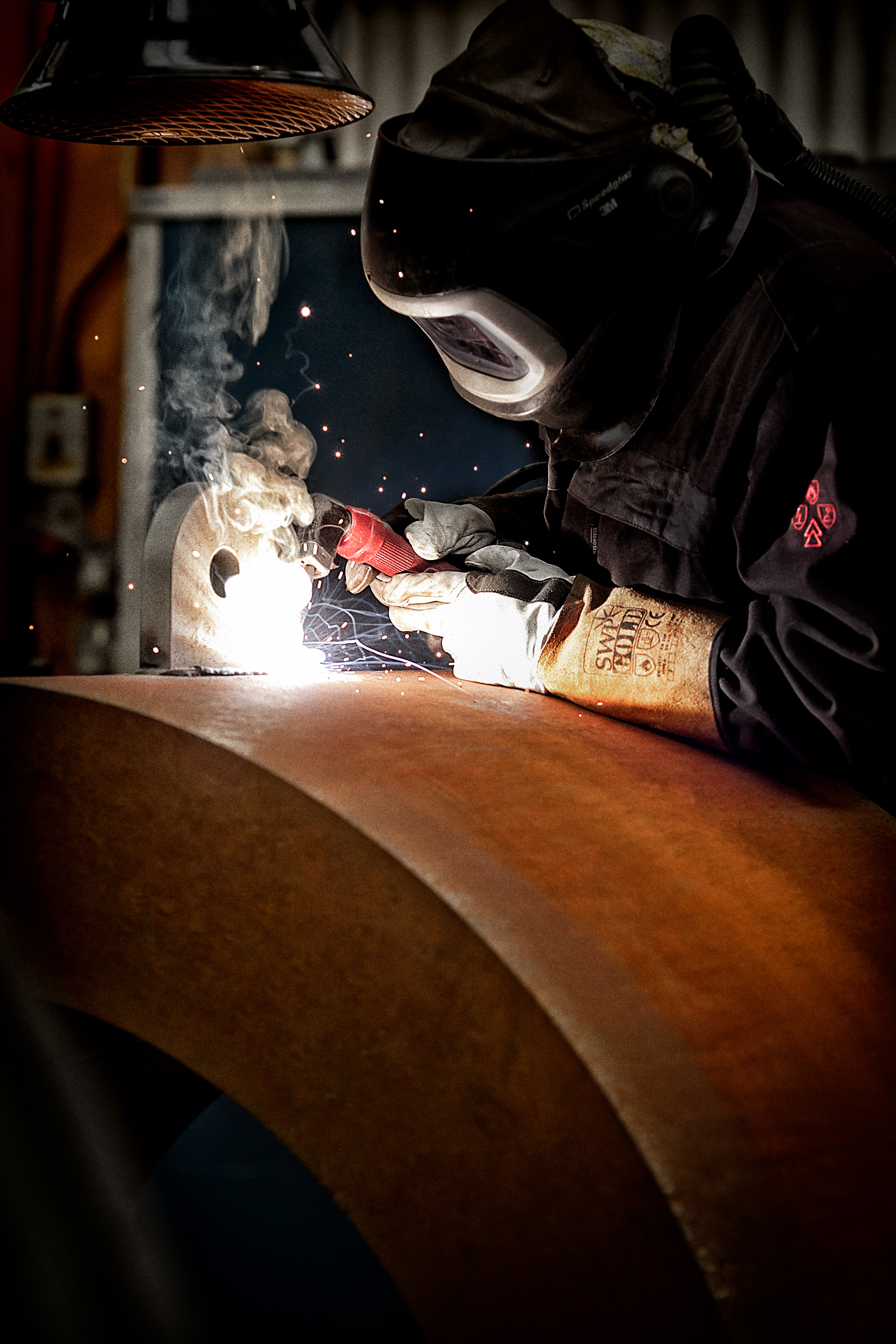 Industrial photograph of man welding
