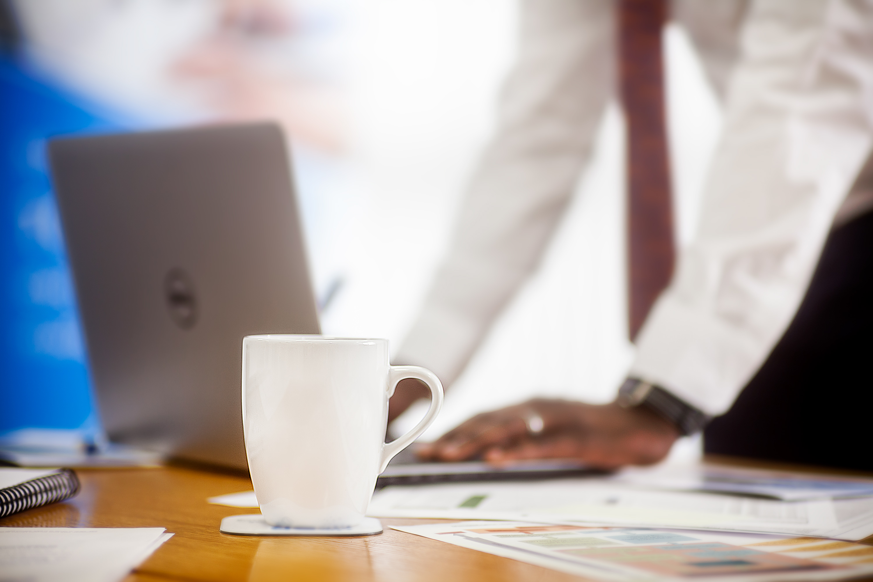 White mug on corporate table setting