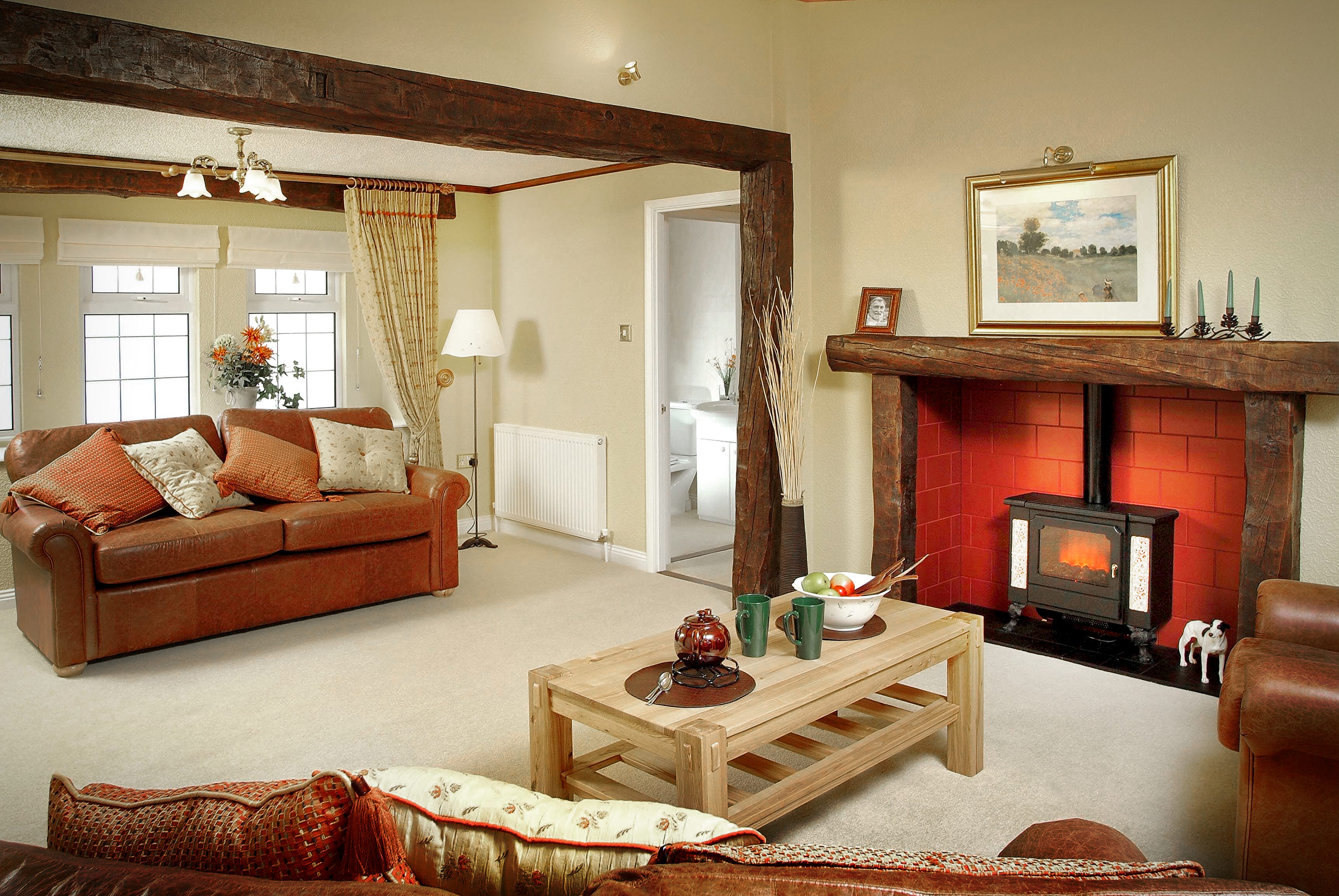 Internal property photograph of mobile home living space with fireplace and wood effect features