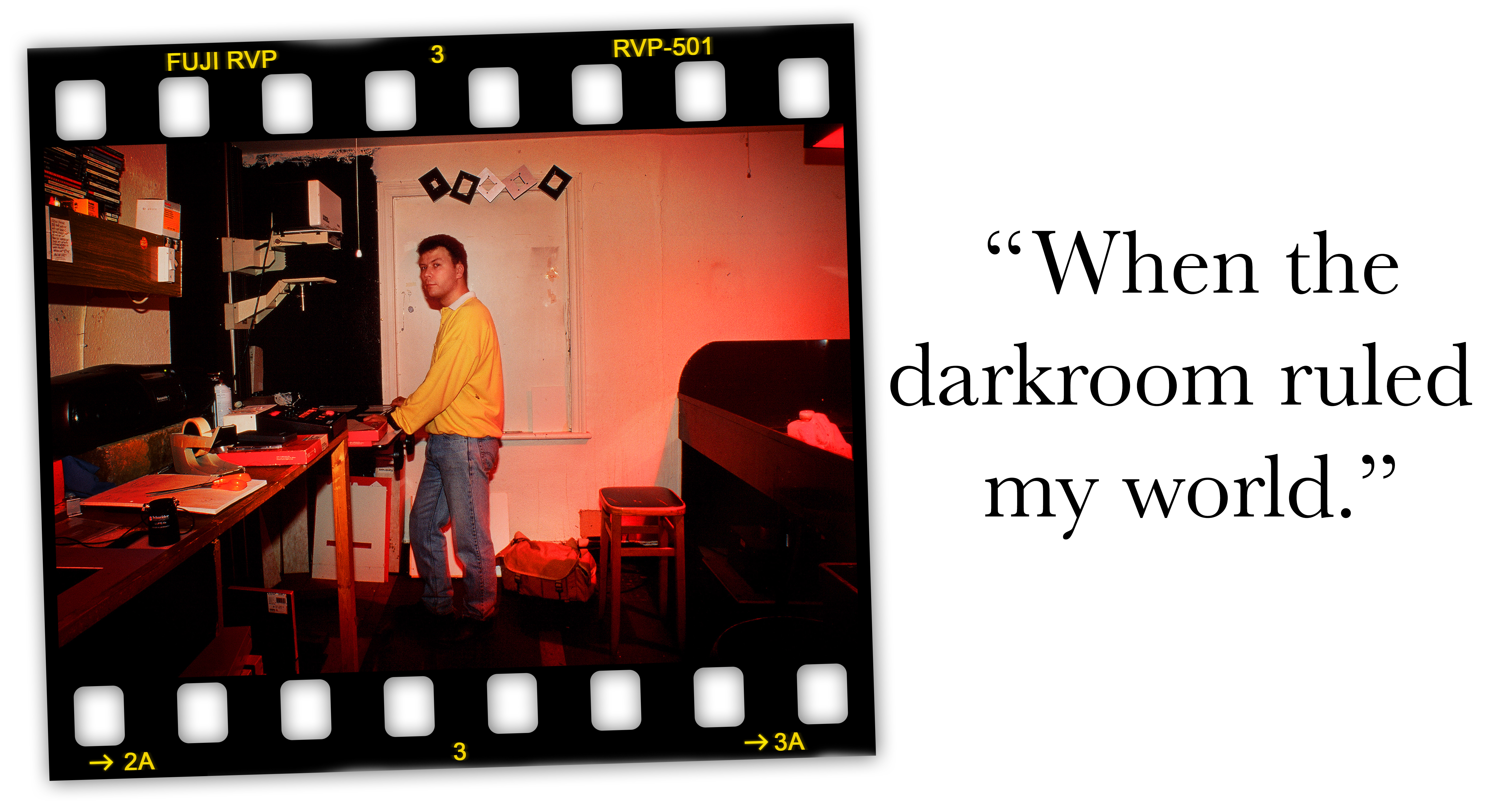 Red lights on in darkroom, Simon Hargrave at a Devere 54 enlarger