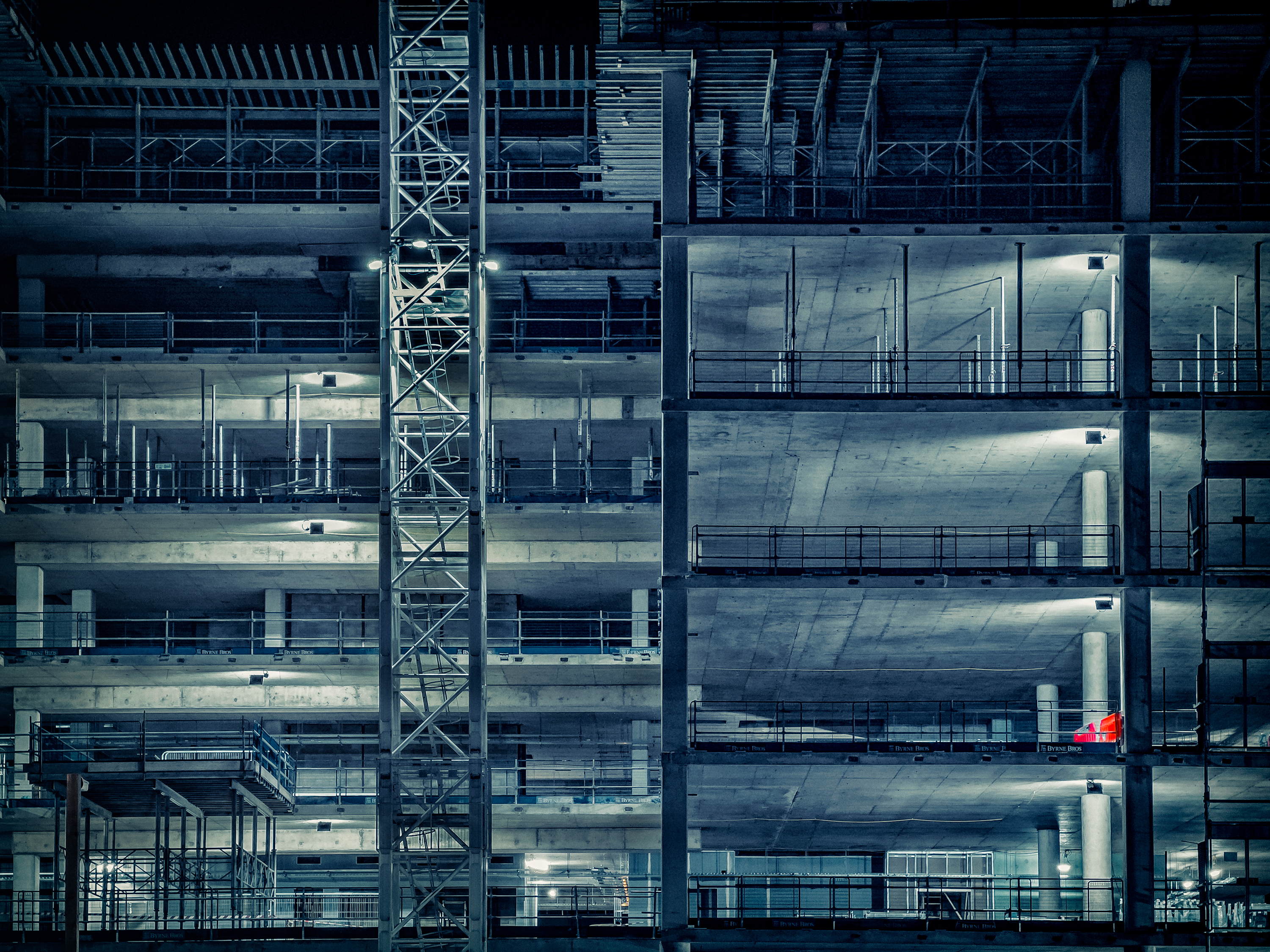 An industrial building site shot showing a new commercial property with silver and blue tones in Milton Keynes